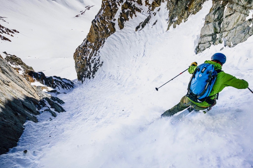 After retreating from the rocky middle section of the Split Couloir, Noah Howell gets hoppy for the exit, Sierras.